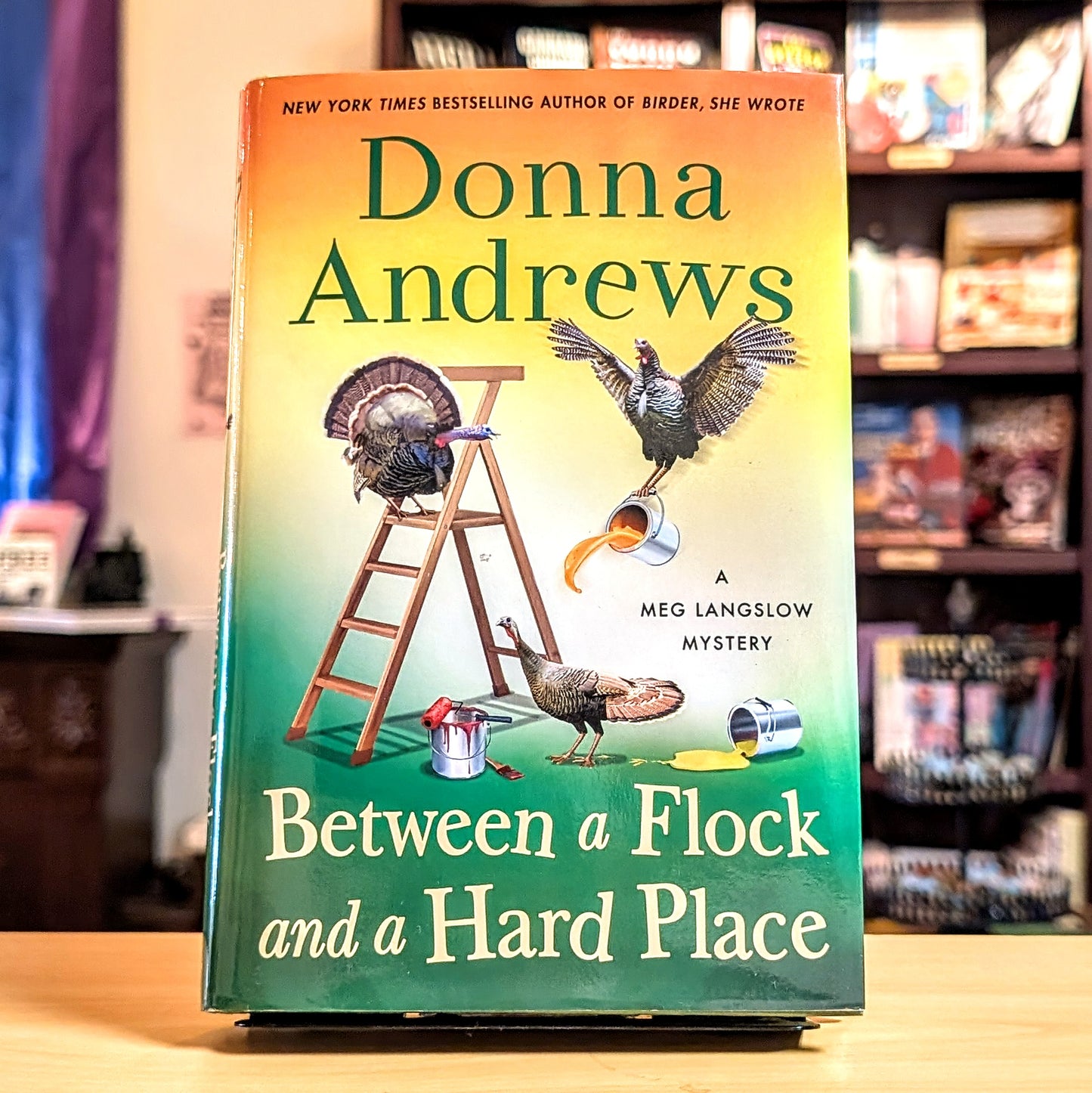 Between a Flock and a Hard Place: A Meg Langslow Mystery